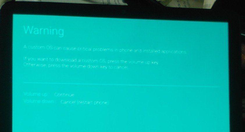 Blue screen displaying warning about installing custom roms - bootloader unlock option missing